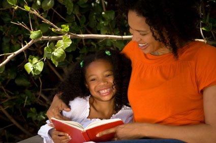 Mother and Daughter read a book outside